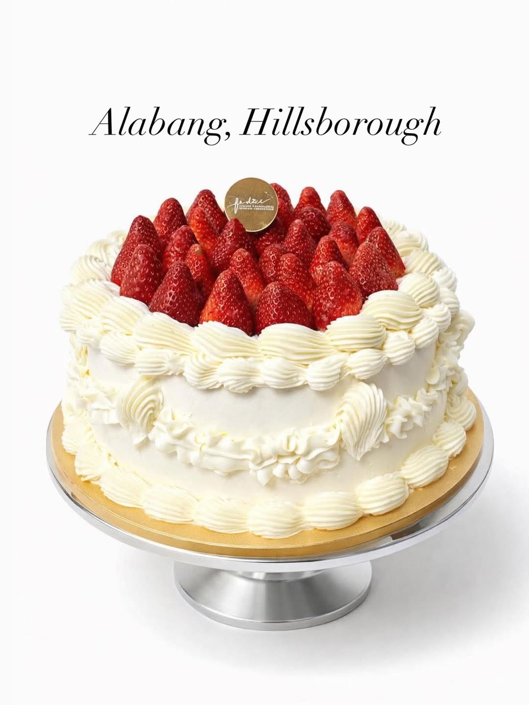 Fédici Piped Cream Strawberry Cheesecake on a cake stand